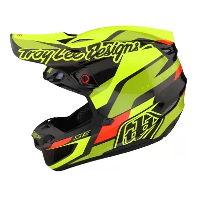Capacete integral motocross preto e amarelo fluorescente com texto Troy Lee Designs.