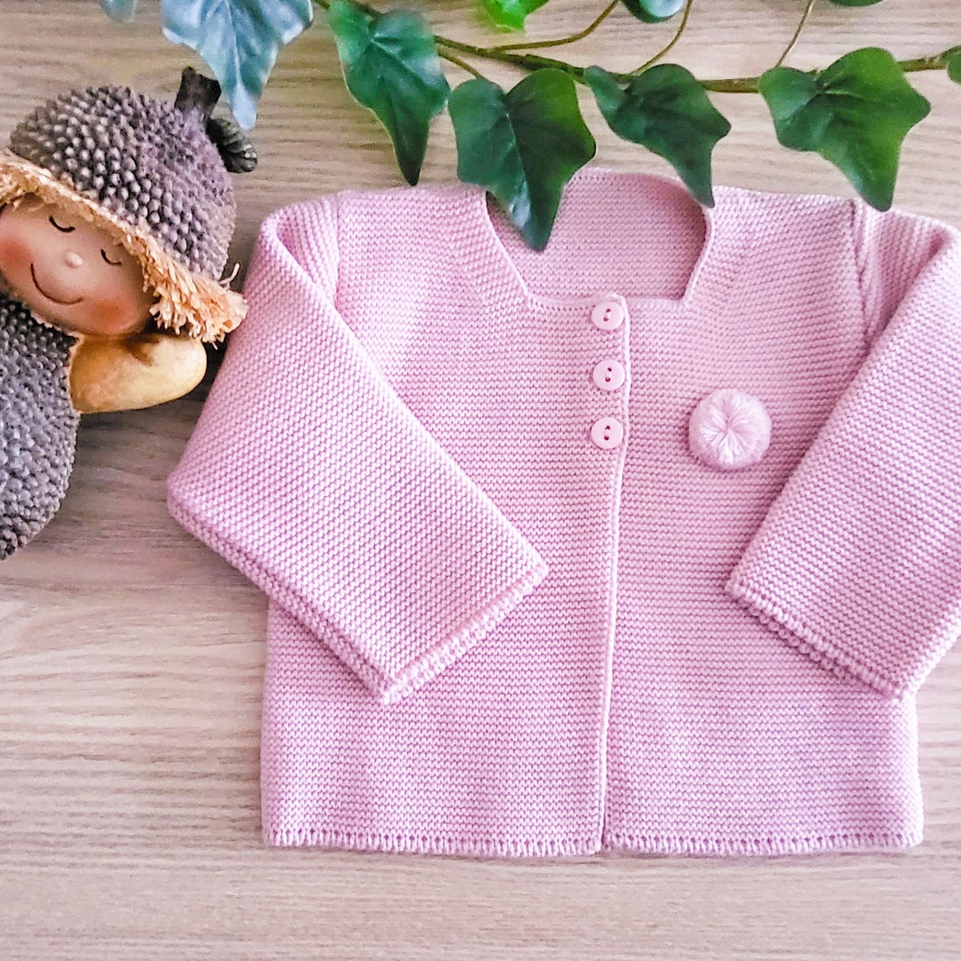 Casaco de malha rosa bebé