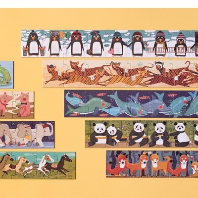 Várias réguas coloridas com desenhos de animais sobre fundo amarelo.