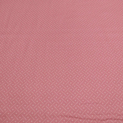 Tecido rosa claro com padrão geométrico branco