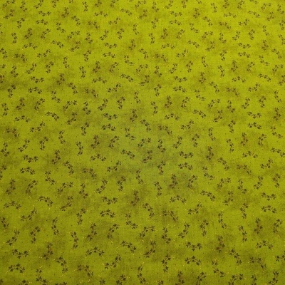 tecido amarelo mostarda com padrão de pequenas flores castanho