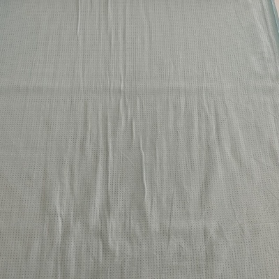 tecido azul claro com padrão de pequenos quadrados