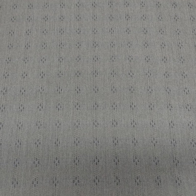 tecido cinzento claro com padrão de pequenos pontos organizados em linhas