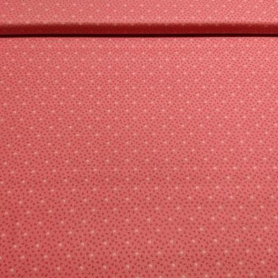 Tecido vermelho com estrelas brancas em padrão repetitivo