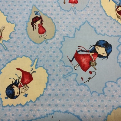 tecido azul claro com padrão de raparigas em folhas amarelas e azul claro