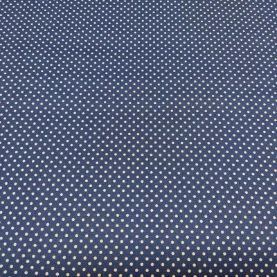 Tecido azul com pequenos pontos brancos em padrão uniforme