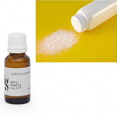 Frasco de essência aromática e frasco a soltar pó branco sobre fundo amarelo