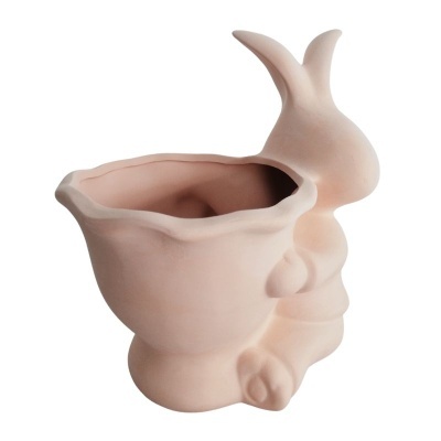 Vaso de cerâmica rosa claro em forma de coelho com espaço aberto para plantas