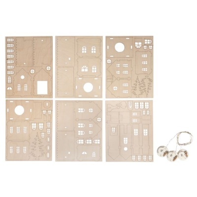 Placas de cartão cortadas para montagem de casa com luzes LED pequenas ao lado