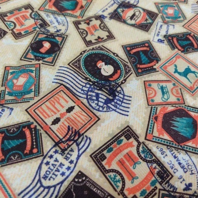 Tecido INDIGO Selos/Etiquetas Natal T1331