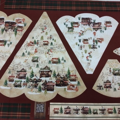 Tecido estampado com peças recortadas mostrando casas asiáticas tradicionais em fundo claro e padrão xadrez ao redor.