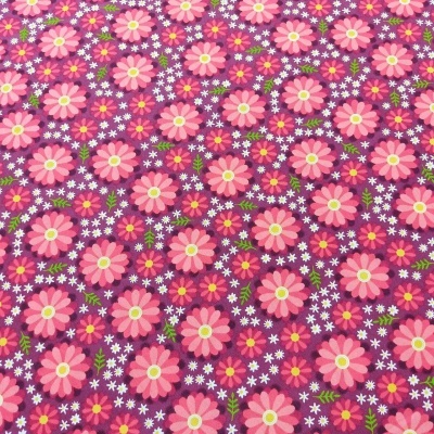 Tecido com padrão floral colorido em fundo roxo