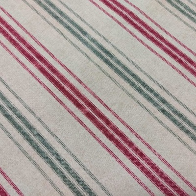 tecido com riscas diagonais vermelhas e verdes sobre fundo bege