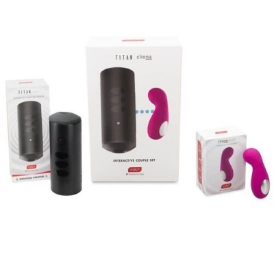 Conjunto interativo para casais TITAN com dispositivo preto e vibrador rosa em embalagens.
