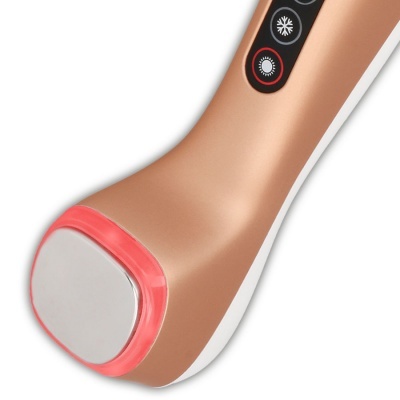 Aparelho de cuidado pessoal bronze com superfície metálica e botões