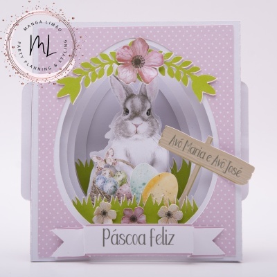 Caixa decorativa de Páscoa com coelho, ovos e flores em fundo rosa