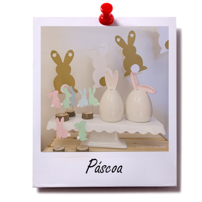 Decoração de Páscoa com coelhos coloridos, cerâmicos e guirlanda
