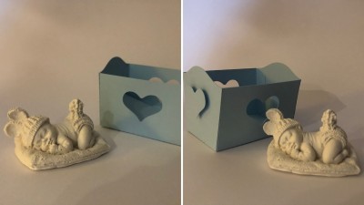 Bebé no berço em gesso perfumado