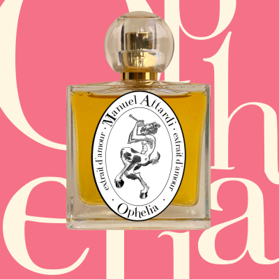 Perfume bottle with golden yellow liquid and Manuel Attardi extrait damour Ophelia label on a pink background with cream letters