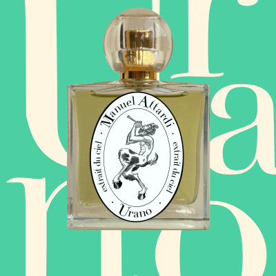 Square glass perfume bottle with transparent spherical cap and labelled Manuel Attardi Urano