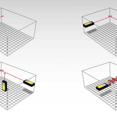 Modelo 3D de um ambiente cúbico com dispositivos amarelos e pretos posicionados em vários cantos e linhas vermelhas