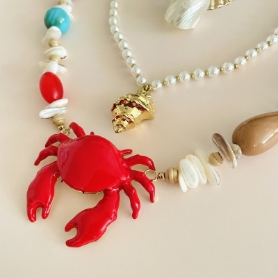 Colar caranguejo ou colar pérolas e búzio