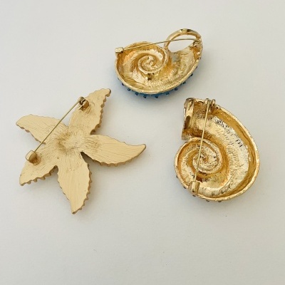 Pregadeiras búzios e estrela do mar