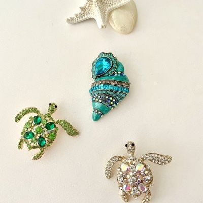 Pregadeiras búzio e tartarugas