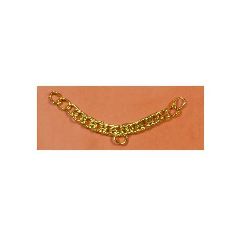 Pulseira dourada em corrente com elo central maior sobre superfície laranja