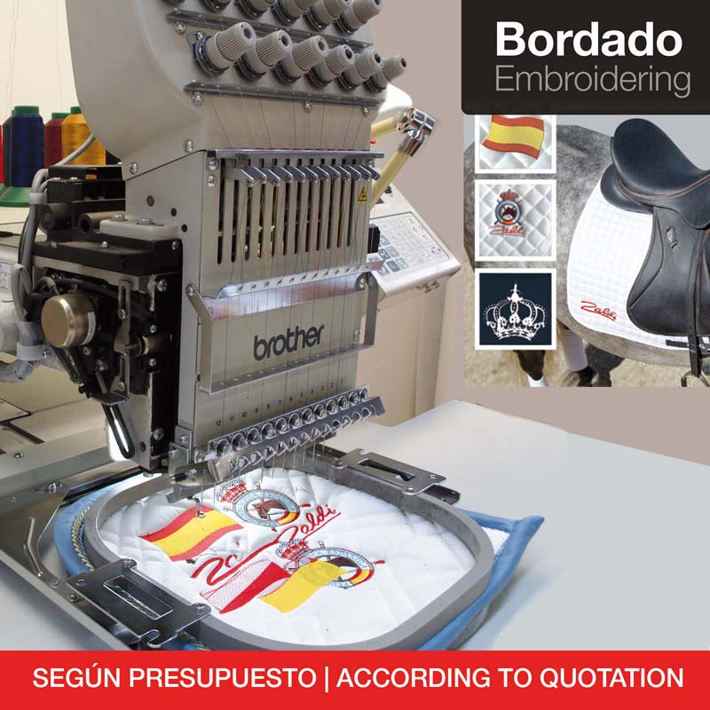 Máquina de bordar Brother a bordar tecido branco com desenhos coloridos.