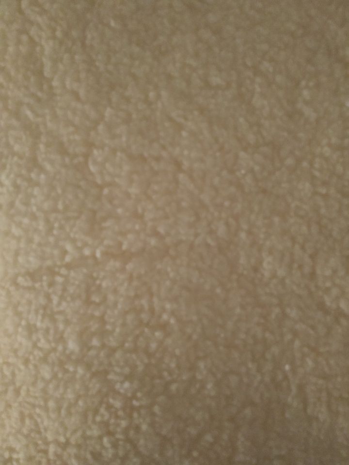 Textura de tecido castanho claro com padrão irregular