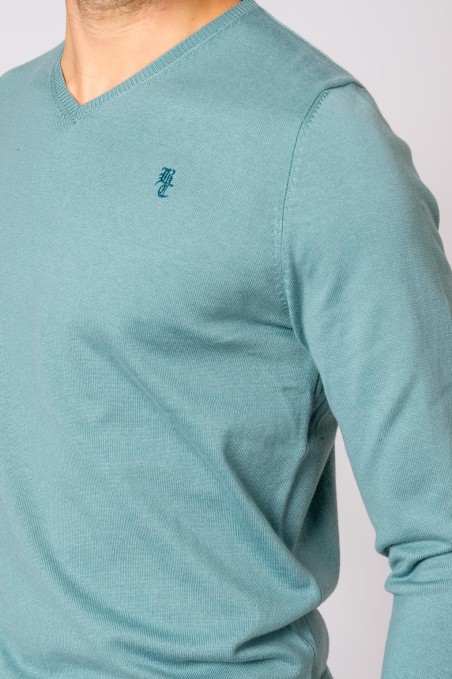 Camisola azul esverdeada de manga comprida e decote em V com bordado no peito