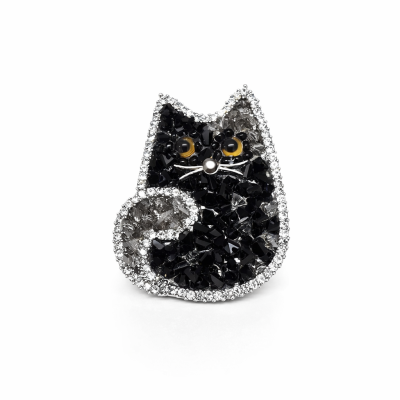 Broche em forma de gato com cristais pretos e cinzentos e olhos amarelos