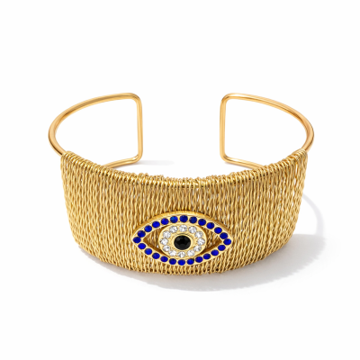 Pulseira dourada com olho decorativo colorido no centro