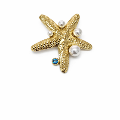 Broche dourado em forma de estrela do mar com pérolas e pedra azul