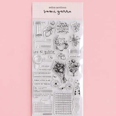 Conjunto de carimbos acrílicos com desenhos e textos em espanhol em embalagem com fundo rosa