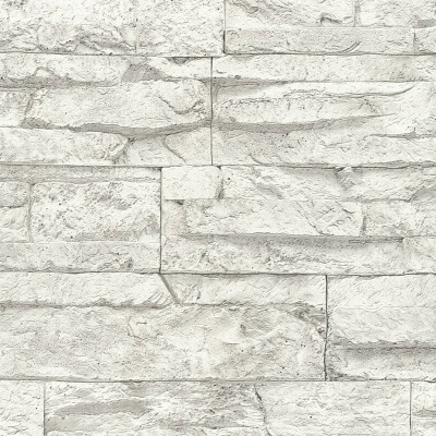 Parede com azulejos de pedra cinza clara em padrão retangular