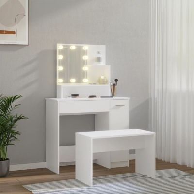 Conjunto móvel maquilhagem branco com espelho iluminado e banco num ambiente interior.