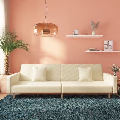 Sofá creme moderno contra parede pêssego com decoração e tapete azul escuro