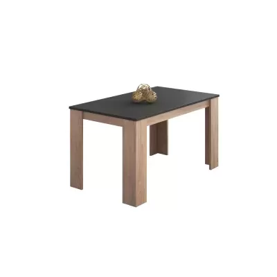 Mesa retangular com tampo preto e pernas de madeira clara com esferas decorativas douradas em cima