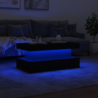 Mesa de centro preta com luz azul e sofá cinzento numa sala