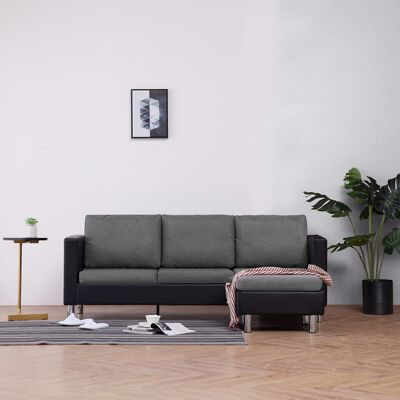 Sofá cinzento com chaise longue em sala minimalista com plantas e quadro