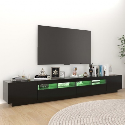 Móvel de TV preto brilhante com gavetas e arrumação com vidro iluminado num ambiente de sala minimalista.