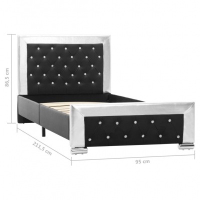 Cama de solteiro preto com bordas prateadas e botões brilhantes