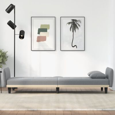 Sofá cama cinzento com estrutura em madeira clara e pés pretos numa sala minimalista