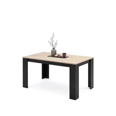 Mesa retangular de madeira clara com pernas pretas e decoração minimalista em cima.