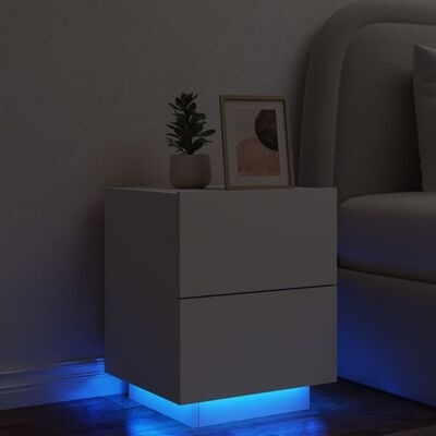 Mesa de cabeceira branca com iluminação LED azul e decoração com planta e moldura