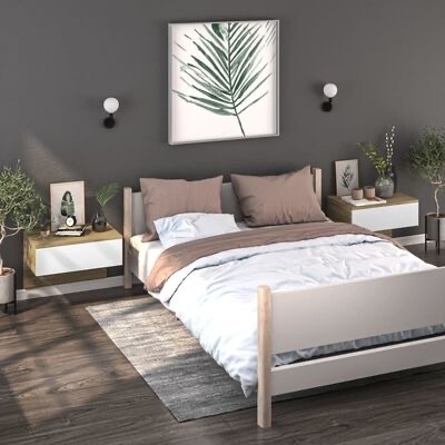 quarto com cama de madeira clara, roupa de cama branca, almofadas castanhas, mesas de cabeceira suspensas, parede cinzenta e quadro com folha verde