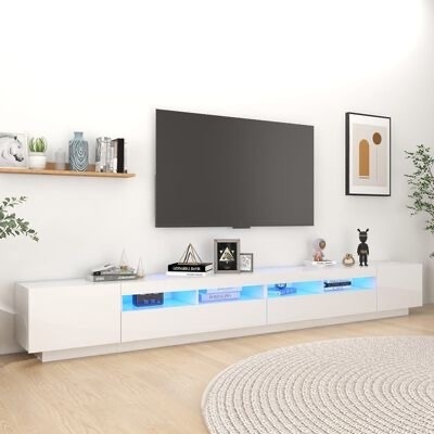 Móvel TV branco moderno com nichos iluminados e decoração, televisão na parede, estante com objetos e plantas, quadro abstrato e tapete redondo cinza