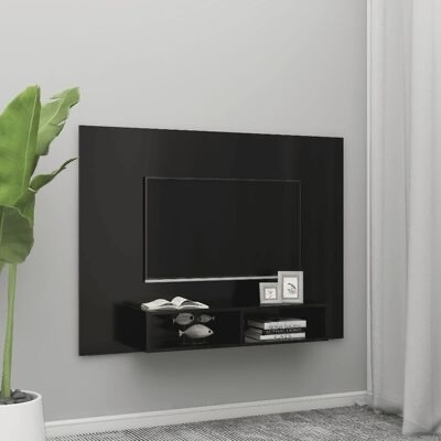 Painel televisivo preto brilhante com prateleira e decoração numa sala minimalista